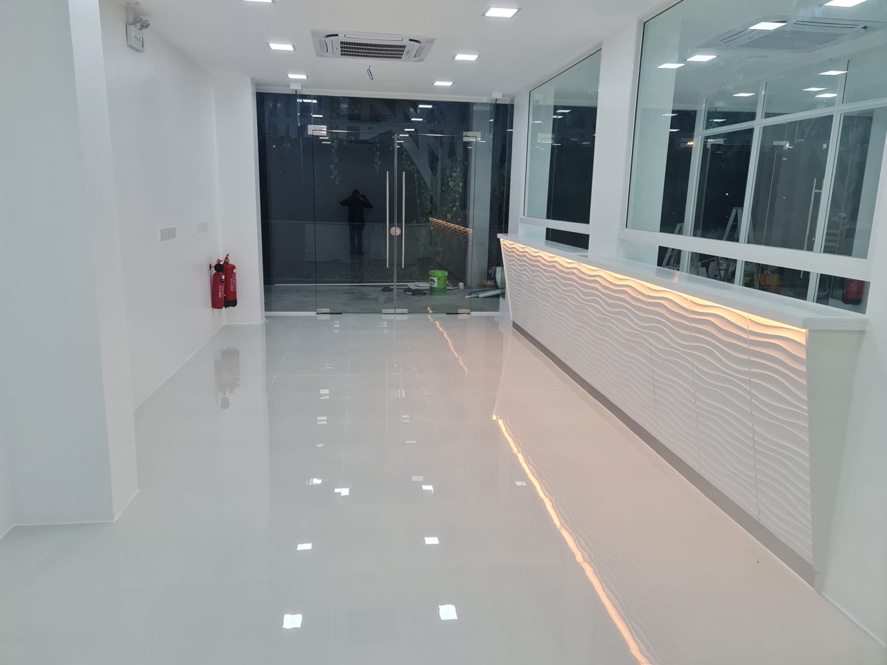 Reception counter with backlit feature wall